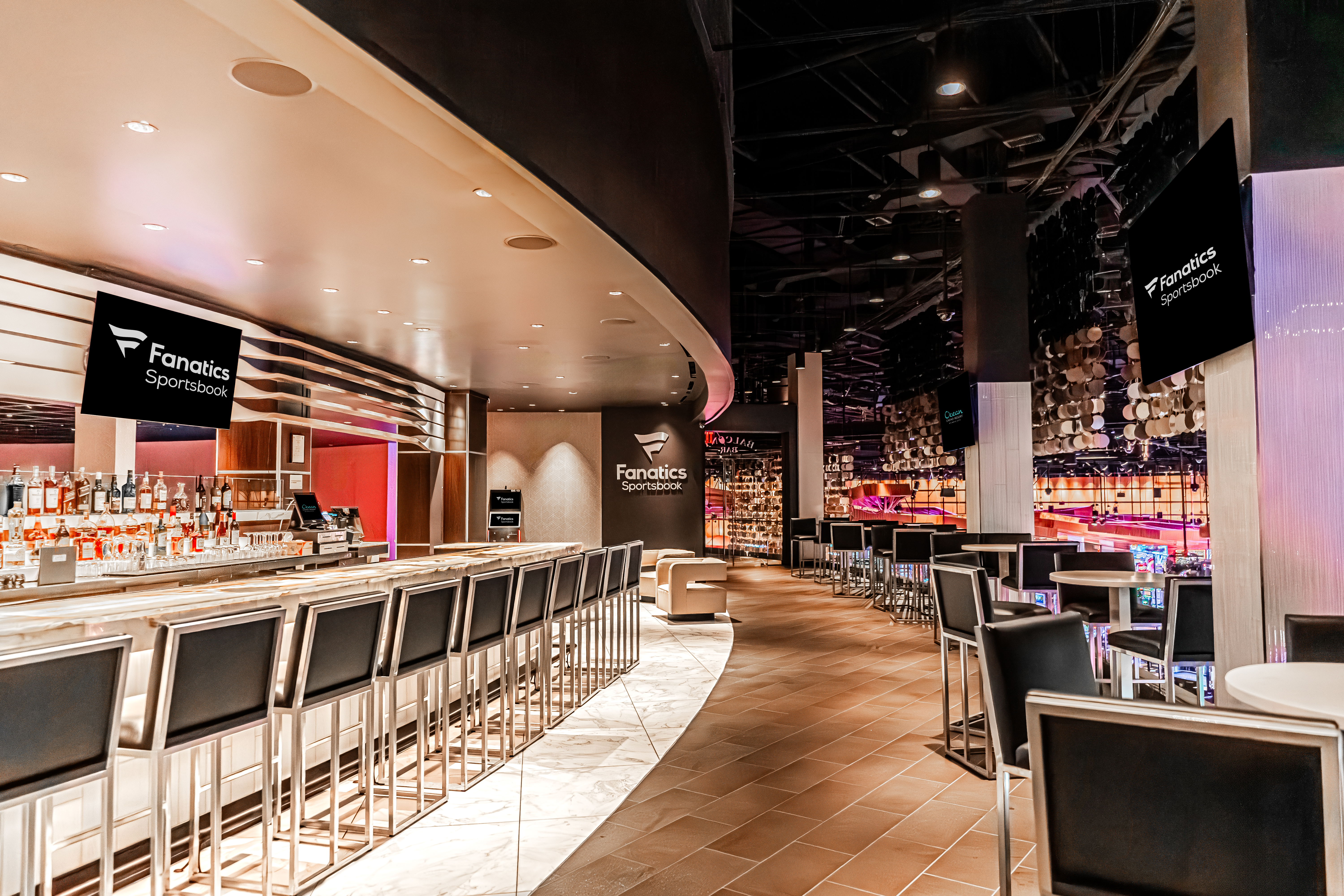 Fanatics Sportsbook bar at Ocean Casino Resort featuring high-top seating, large screens, and a modern sportsbook lounge designed for watching live sports.