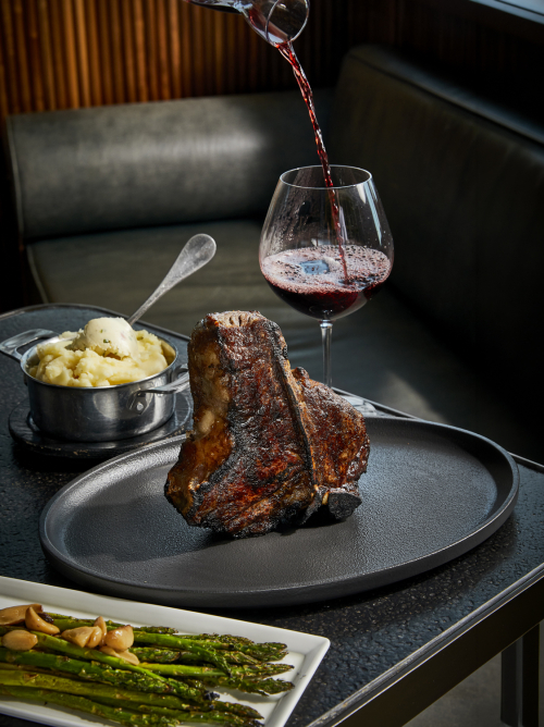 Dry-aged porterhouse steak with red wine at Ocean Casino Resort fine dining restaurant.