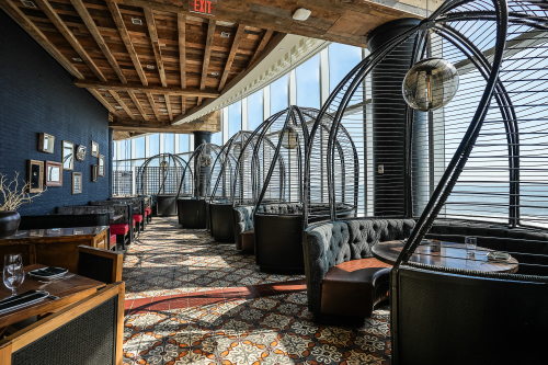 Amada restaurant interior with private cocoon seating and ocean views at Ocean Casino Resort