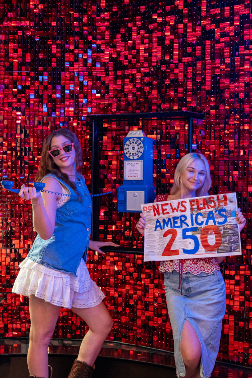 Guests posing with patriotic Fourth of July photo props at America's Birthday Bar at Ocean Casino Resort