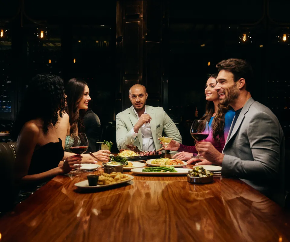 A group of friends enjoying dinner at Ocean Steak