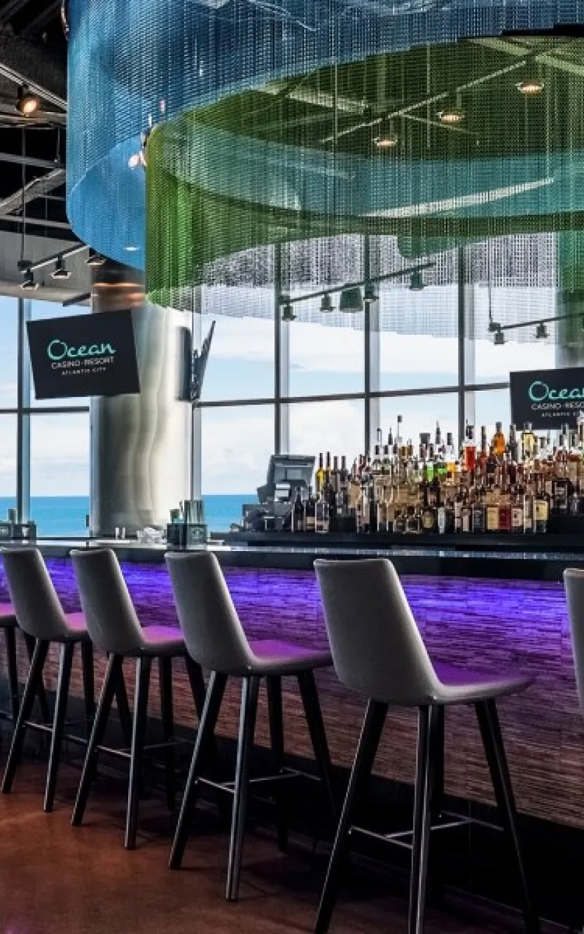 Bar with oceanfront views at Ocean Casino Resort, perfect for enjoying drinks while watching pro football games.