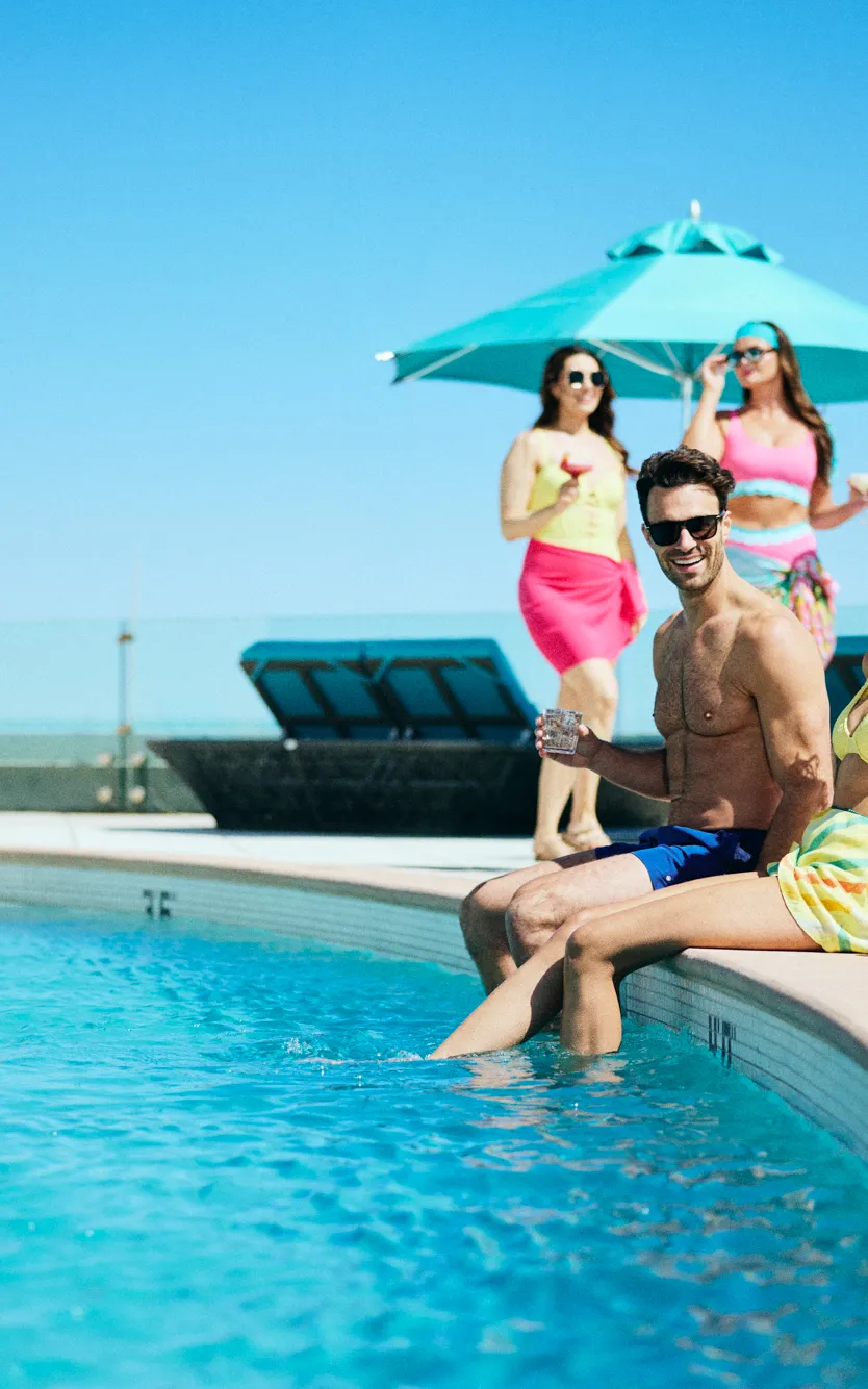 Friends sitting by the Cabanas pool at Ocean Casino Resort