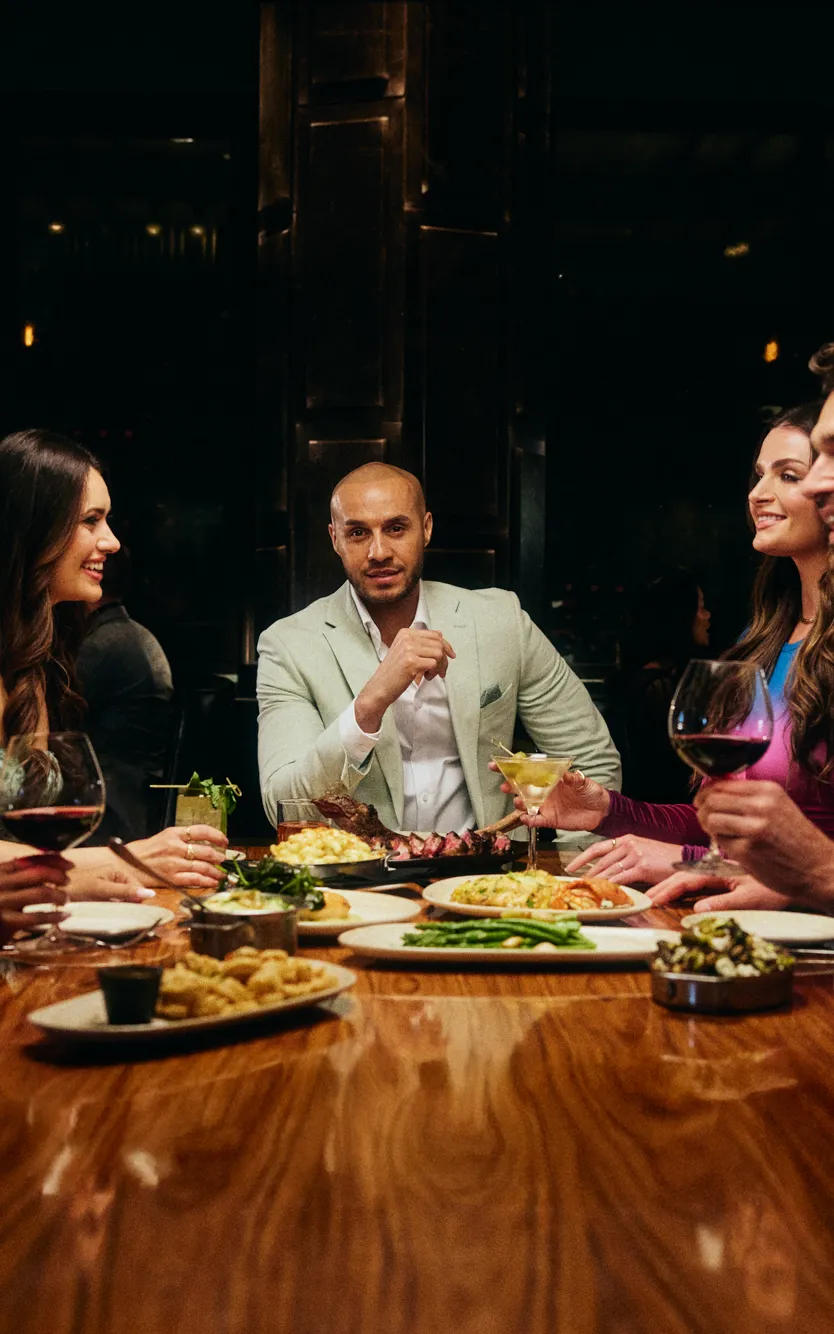 A group of friends enjoying dinner at Ocean Steak