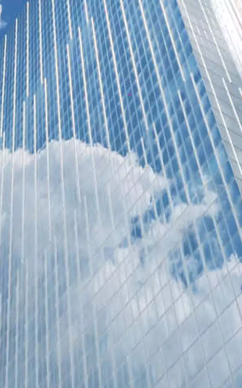 Exterior of Ocean Casino Resort reflecting blue skies and white clouds