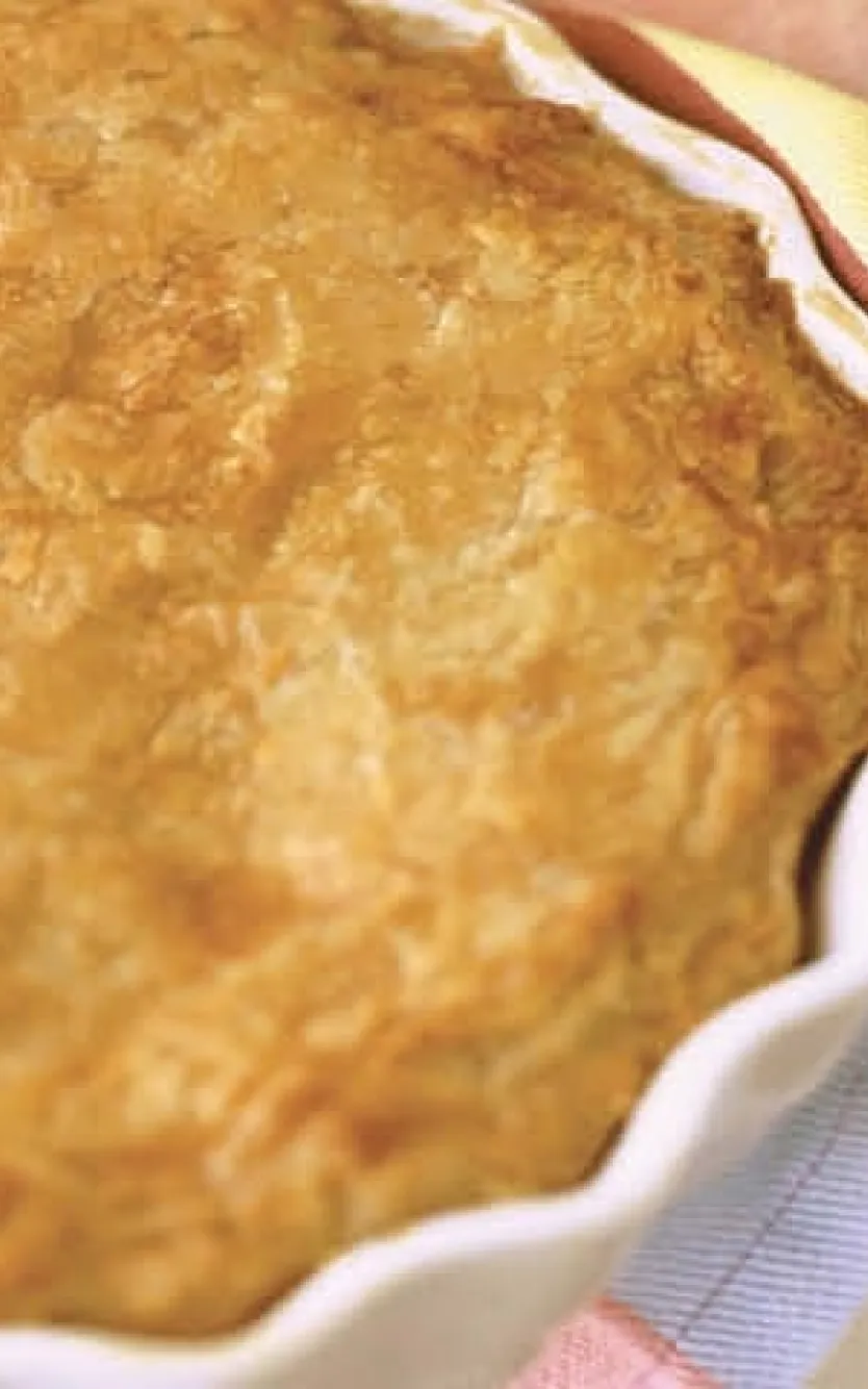 Little girl holding a fresh-baked pie