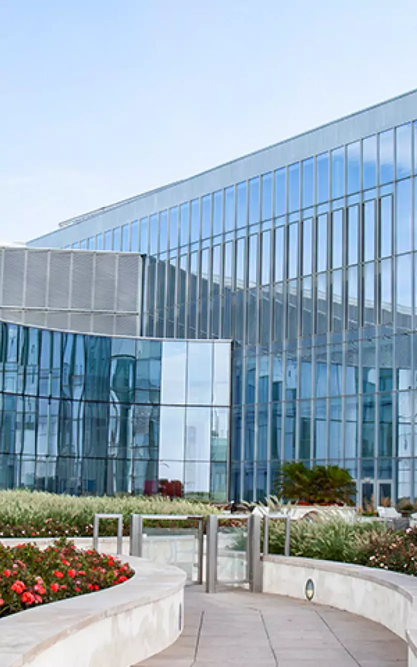 Image of the exterior of Ocean Casino and The Park with greenery and a walkway