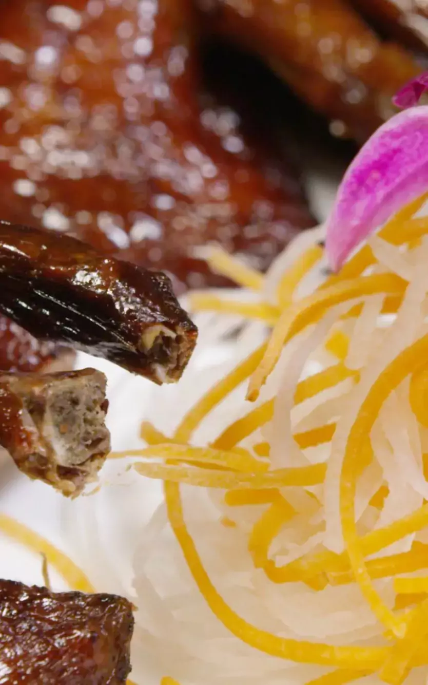 close-up of dish with noodles and meat for Lunar New Year