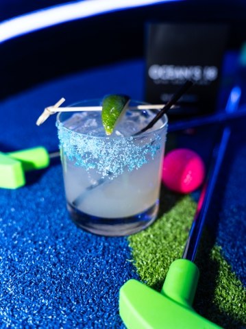 Salt-rimmed margarita cocktail with lime garnish at Ocean’s 18 Mini Golf & Bar in Atlantic City