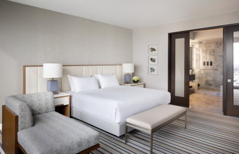 Modern king bedroom with spa-style bathroom in Ocean Casino Resort luxury suite Atlantic City