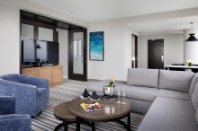 Luxury suite living room with champagne and ocean views at Ocean Casino Resort in Atlantic City