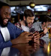 Guys at bar watching sports