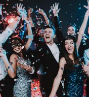 group of young adults celebrating a holiday party