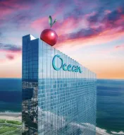 Ocean Casino Resort with giant cherry on rooftop at sunset, celebrating its 7th birthday in Atlantic City.