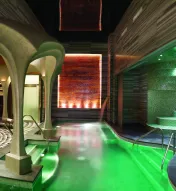 Luxurious Exhale Spa + Bathhouse at Ocean Casino Resort in Atlantic City, featuring hydrotherapy pool, mosaic tile seating, and relaxation lounges.