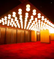 Entrance to Ovation Hall at Ocean Casino Resort in Atlantic City, featuring red carpet flooring and marquee-style ceiling lights.