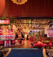 Festive Jingle Bell Bar at Ocean Casino Resort featuring holiday lights, décor, and themed cocktails.
