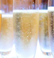 Chilled champagne flutes filled with sparkling wine, ready for a New Year’s Eve toast.