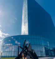 Exterior view of Ocean Casino Resort with a modern glass tower and outdoor fire feature on a clear winter day