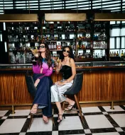 Two girls enjoying drinks at the bar at Ocean Steak in Ocean Casino Resort