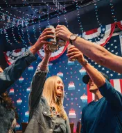 Friends raising a toast during Fourth of July celebrations at America's Birthday Bar at Ocean Casino Resort