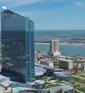Aerial view of Ocean Casino Resort with Atlantic City and water in the background