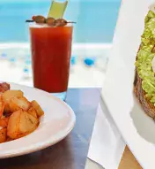 Two-image collage with breakfast dishes including eggs, potatoes, a bloody mary and avocado toast