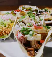 Various plated tacos at Distrito restaurant