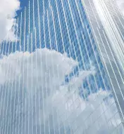Exterior of Ocean Casino Resort reflecting blue skies and white clouds