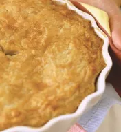 Little girl holding a fresh-baked pie