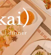 Image of several dishes on a table and the ma-kai logo saying "Book Now"