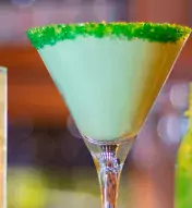 Three green cocktails lined up for St. Paddy's Day