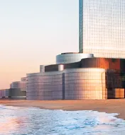 Exterior of Ocean Casino Resort next to the beach and water