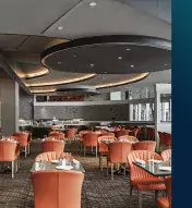 Sleek, modern dining room with tables and chairs and the {ma-kai} logo