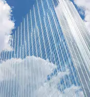 Exterior of Ocean Casino Resort reflecting blue skies and white clouds
