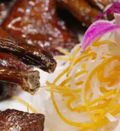 close-up of dish with noodles and meat for Lunar New Year
