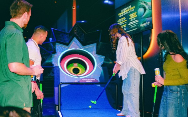 people playing mini golf
