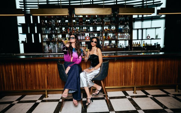 Girls sitting at the bar