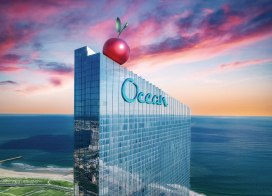 Ocean Casino Resort with giant cherry on rooftop at sunset, celebrating its 7th birthday in Atlantic City.