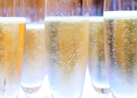Chilled champagne flutes filled with sparkling wine, ready for a New Year’s Eve toast.