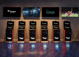 Fanatics Sportsbook self-service betting kiosks at Ocean Casino Resort with live sports displayed on overhead screens for easy in-person wagering.