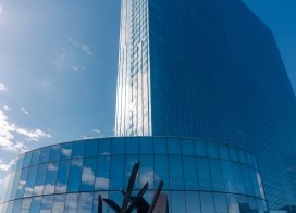 Exterior view of Ocean Casino Resort with a modern glass tower and outdoor fire feature on a clear winter day