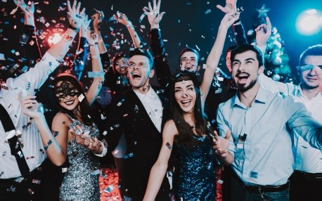 group of young adults celebrating a holiday party